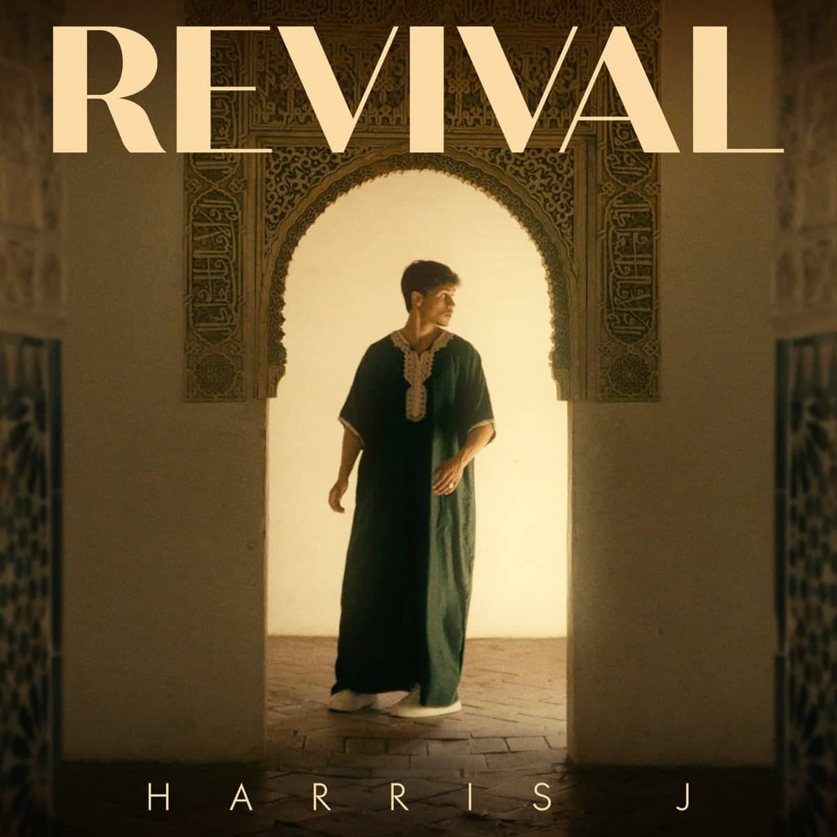 Revival cover: Harris J in a green djellaba standing beneath a carved Andalusian arch