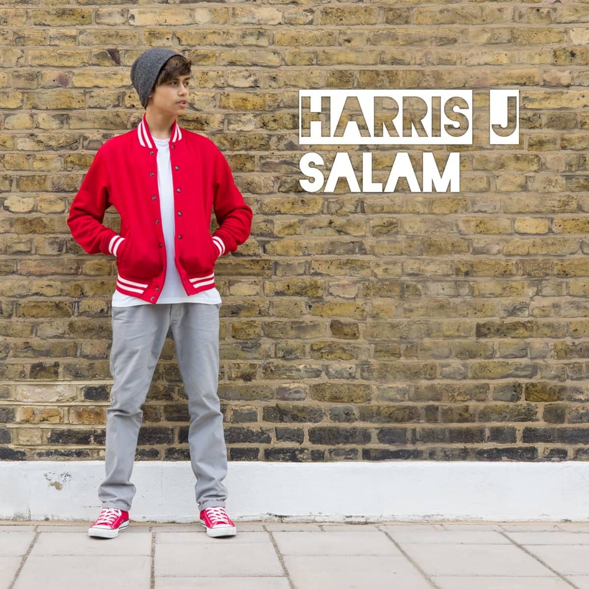Salam cover: a teenage Harris J in a red varsity jacket against a London brick wall